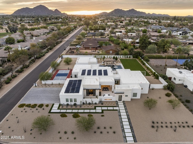 aerial view at dusk with a residential view and a mountain view