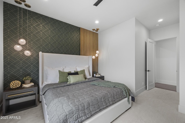 carpeted bedroom featuring recessed lighting, baseboards, an accent wall, and tile walls