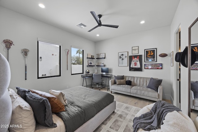 bedroom with ceiling fan, recessed lighting, wood finished floors, and visible vents