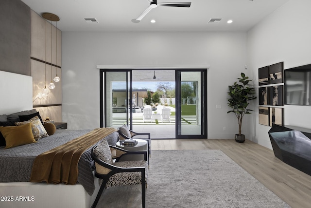 bedroom featuring recessed lighting, visible vents, access to exterior, and wood finished floors