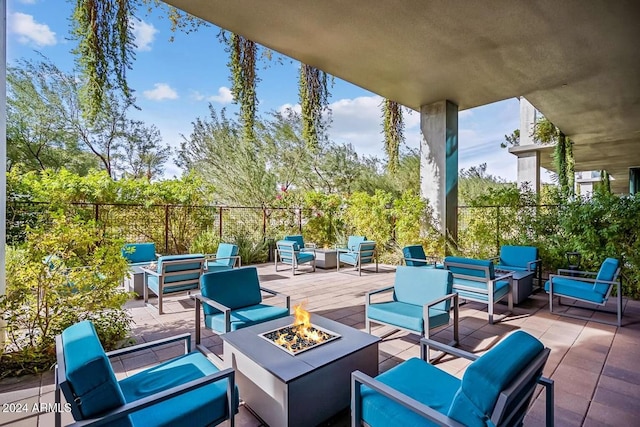 view of patio / terrace featuring an outdoor living space with a fire pit