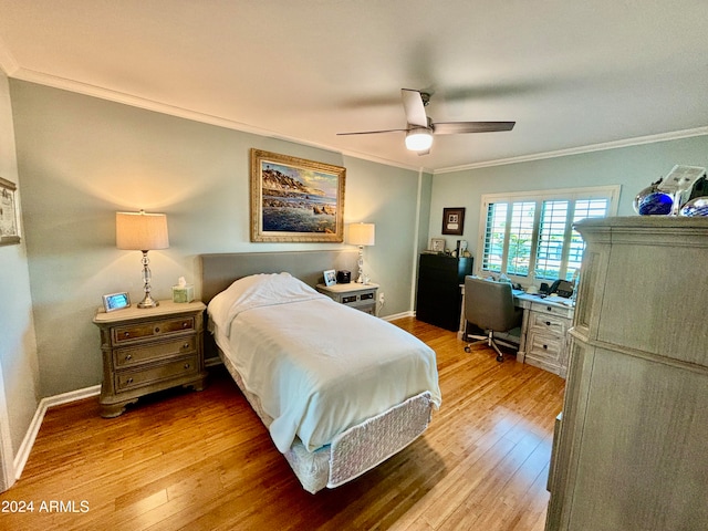 bedroom with hardwood / wood-style flooring, ceiling fan, and crown molding