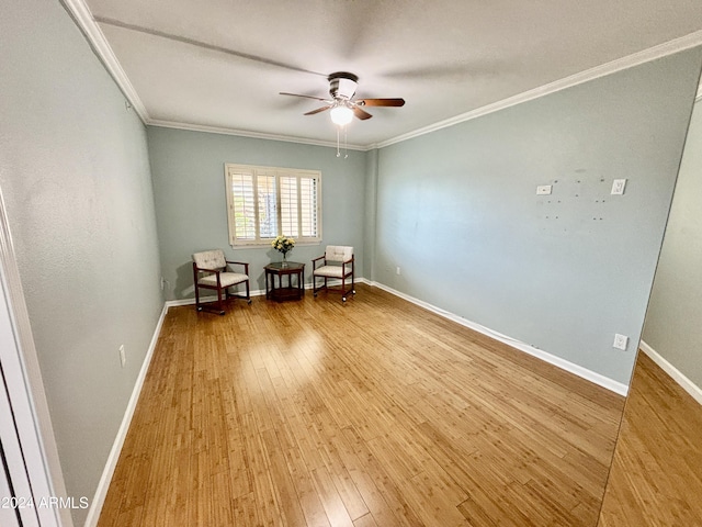 unfurnished room featuring hardwood / wood-style floors, ceiling fan, and crown molding