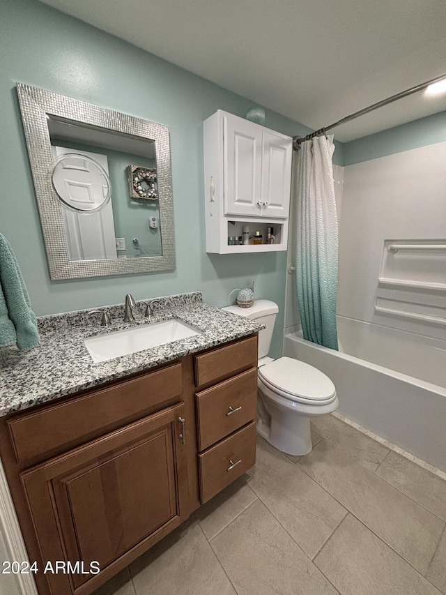 full bathroom with tile patterned floors, shower / tub combo with curtain, vanity, and toilet