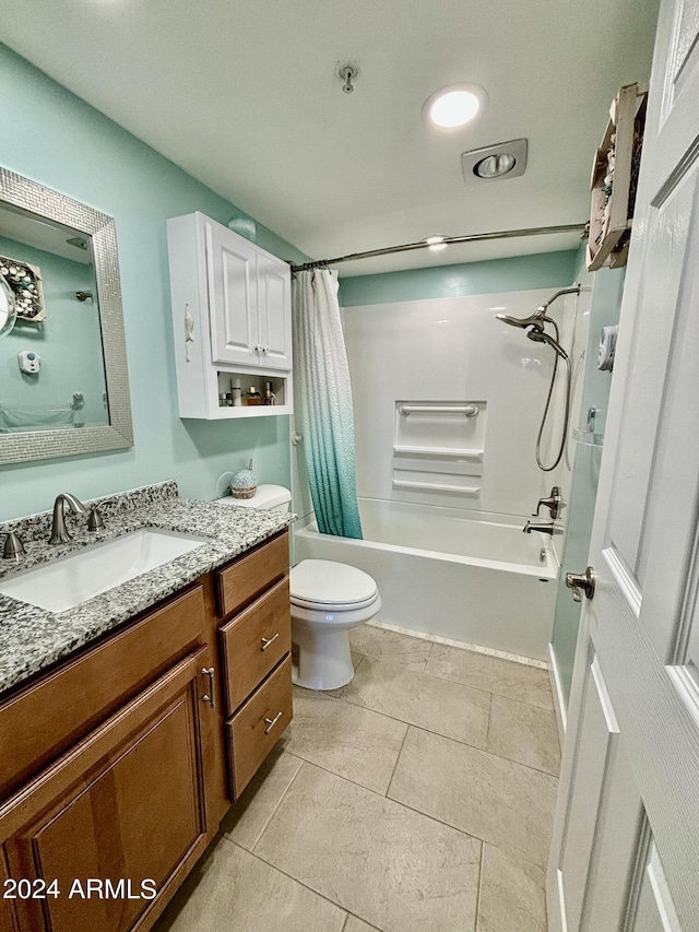 full bathroom featuring shower / bath combination with curtain, toilet, and vanity