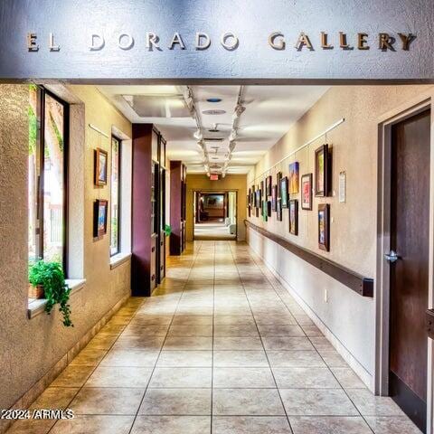 corridor featuring light tile patterned flooring