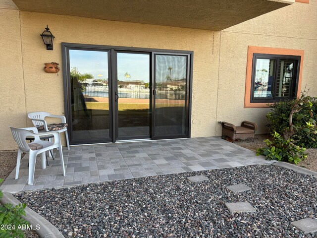 entrance to property featuring a patio