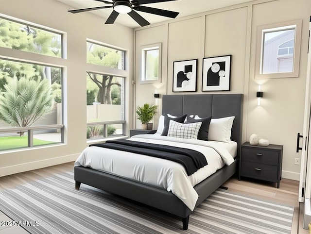 bedroom with baseboards and ceiling fan