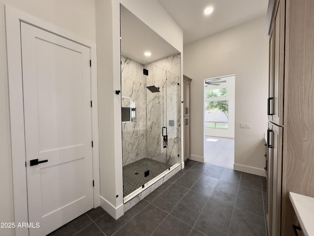 full bath with baseboards, a marble finish shower, recessed lighting, and tile patterned floors