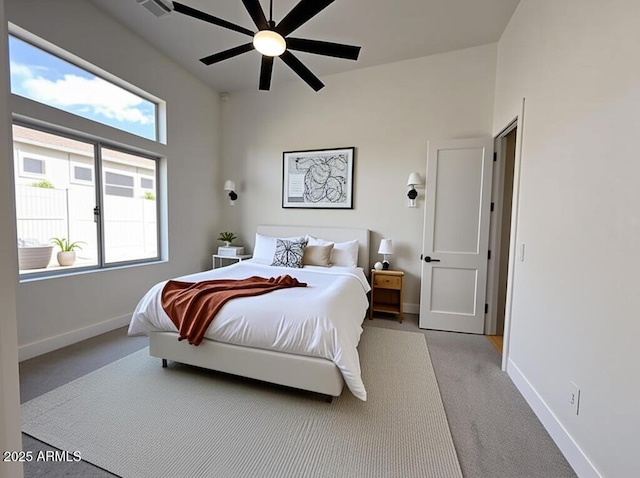 bedroom with carpet flooring, baseboards, and ceiling fan