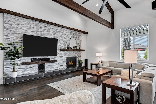 12228 E Wood Dr, Chandler, AZ 85249 - living room featuring vaulted ceiling with beams, a tiled fireplace, wood finished floors, and ceiling fan