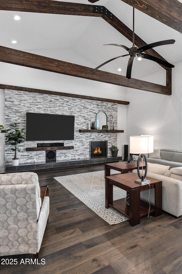 12228 E Wood Dr, Chandler, AZ 85249 - living area featuring recessed lighting, lofted ceiling with beams, a warm lit fireplace, and ceiling fan