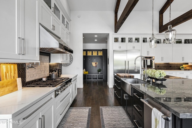 12228 E Wood Dr, Chandler, AZ 85249 - kitchen with tasteful backsplash, under cabinet range hood, a sink, stainless steel appliances, and beam ceiling