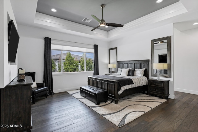 12228 E Wood Dr, Chandler, AZ 85249 - bedroom with visible vents, baseboards, a tray ceiling, recessed lighting, and wood-type flooring