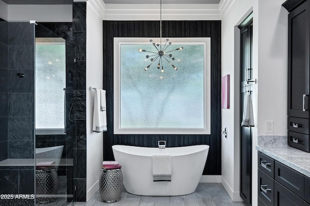 12228 E Wood Dr, Chandler, AZ 85249 - full bath with baseboards, a freestanding bath, an inviting chandelier, a wealth of natural light, and a walk in shower