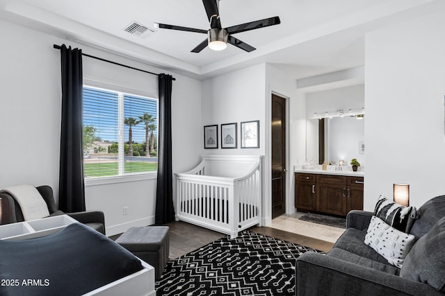 12228 E Wood Dr, Chandler, AZ 85249 - bedroom featuring baseboards, ensuite bathroom, a ceiling fan, visible vents, and a sink