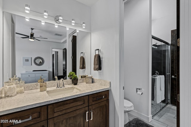 12228 E Wood Dr, Chandler, AZ 85249 - bathroom featuring ceiling fan, vanity, visible vents, toilet, and a stall shower