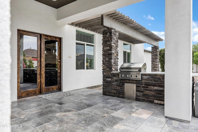 12228 E Wood Dr, Chandler, AZ 85249 - view of patio / terrace featuring a grill and an outdoor kitchen