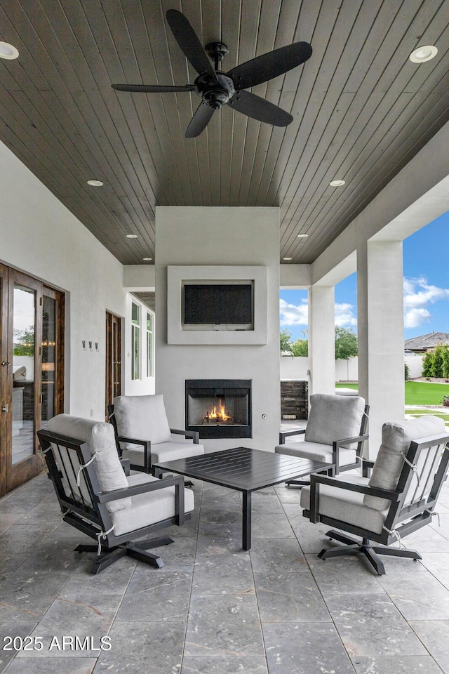 12228 E Wood Dr, Chandler, AZ 85249 - view of patio / terrace featuring an outdoor living space with a fireplace and ceiling fan