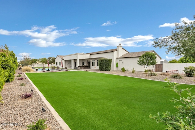 12228 E Wood Dr, Chandler, AZ 85249 - back of house featuring a patio, stucco siding, fence, and a yard