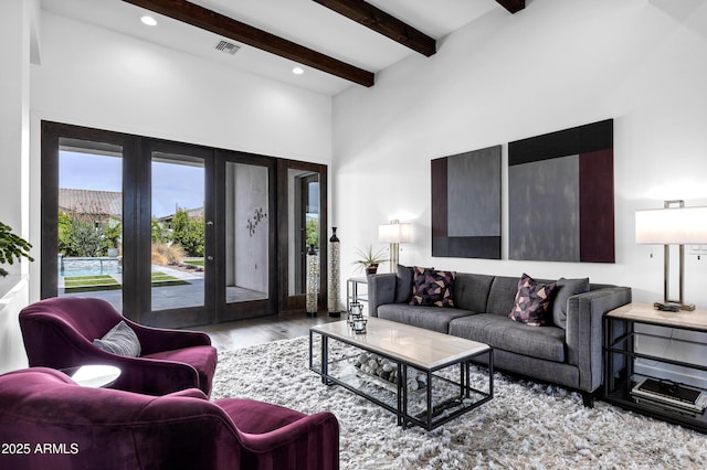 12228 E Wood Dr, Chandler, AZ 85249 - living area with a towering ceiling, french doors, visible vents, beamed ceiling, and wood finished floors
