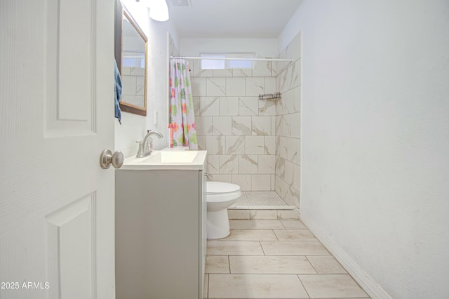 2022 W Atlanta Ave, Phoenix, AZ 85041 - full bathroom with vanity, toilet, and a tile shower