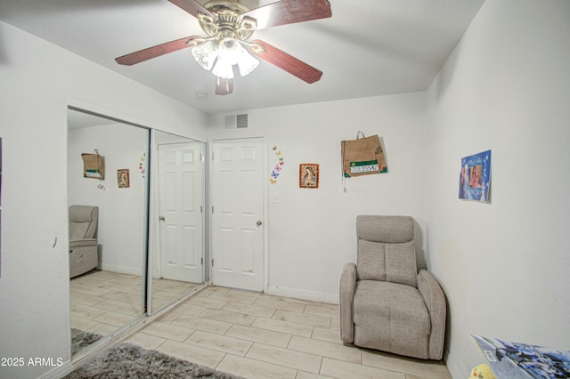 2022 W Atlanta Ave, Phoenix, AZ 85041 - living area featuring visible vents, baseboards, and a ceiling fan
