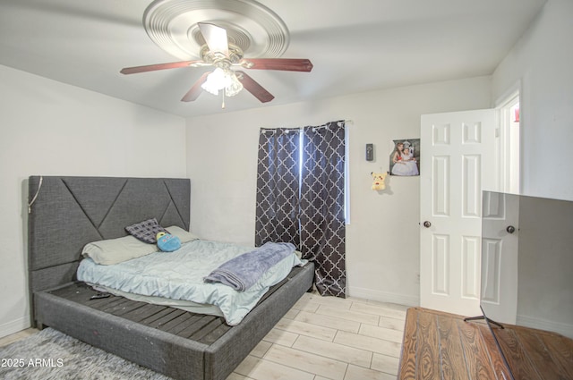 2022 W Atlanta Ave, Phoenix, AZ 85041 - bedroom featuring ceiling fan, baseboards, and wood finish floors