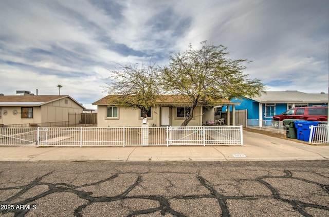 2022 W Atlanta Ave, Phoenix, AZ 85041 - view of front of house featuring a fenced front yard and stucco siding