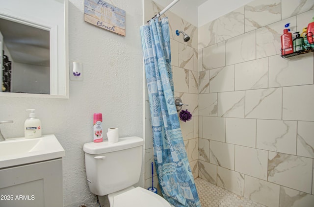 2022 W Atlanta Ave, Phoenix, AZ 85041 - bathroom featuring a tile shower, toilet, vanity, and a textured wall