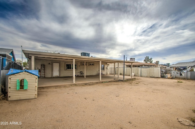2022 W Atlanta Ave, Phoenix, AZ 85041 - rear view of house with a patio and fence