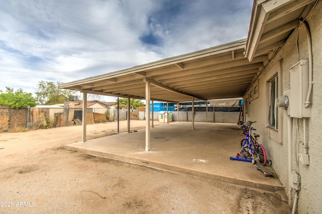 2022 W Atlanta Ave, Phoenix, AZ 85041 - view of car parking with an attached carport and fence