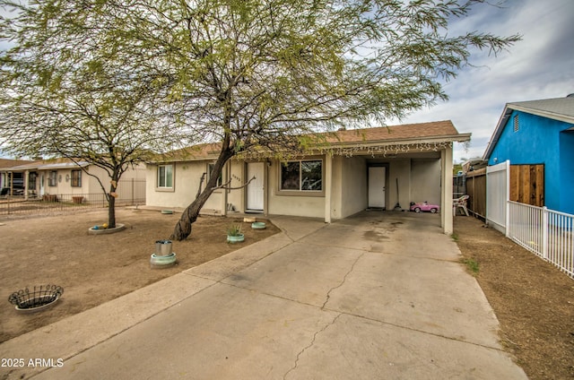 2022 W Atlanta Ave, Phoenix, AZ 85041 - view of front of house with an attached carport, concrete driveway, fence, and stucco siding