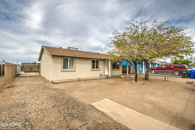 2022 W Atlanta Ave, Phoenix, AZ 85041 - view of front facade featuring a gate, stucco siding, and fence