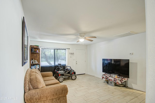 2022 W Atlanta Ave, Phoenix, AZ 85041 - living room featuring visible vents, light wood-style flooring, baseboards, and ceiling fan