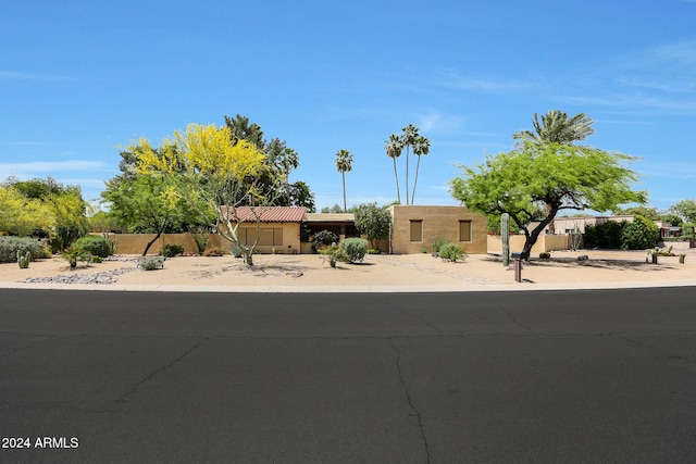 830 E Fairway Dr, Litchfield Park, AZ 85340 - view of front of home featuring stucco siding, a tiled roof, and fence