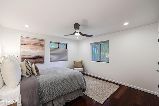 bedroom with hardwood / wood-style floors and ceiling fan