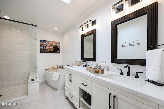 bathroom featuring tile patterned floors, vanity, and separate shower and tub