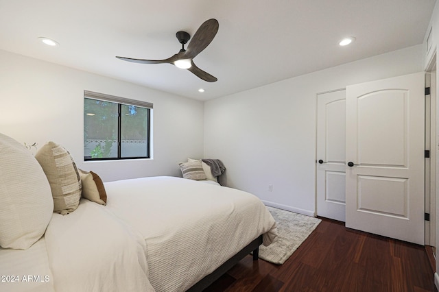 bedroom featuring ceiling fan and dark hardwood / wood-style floors