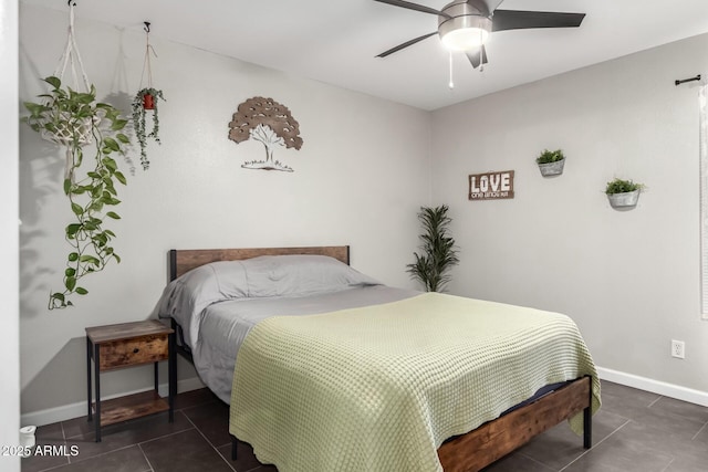 bedroom with baseboards, ceiling fan, and tile patterned flooring