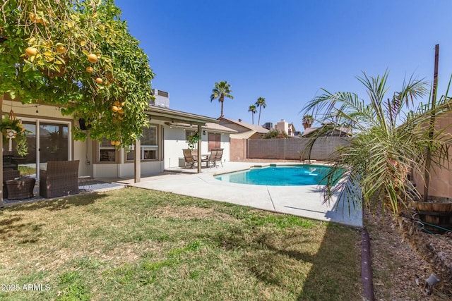 view of swimming pool featuring a patio, a fenced backyard, a fenced in pool, and a lawn