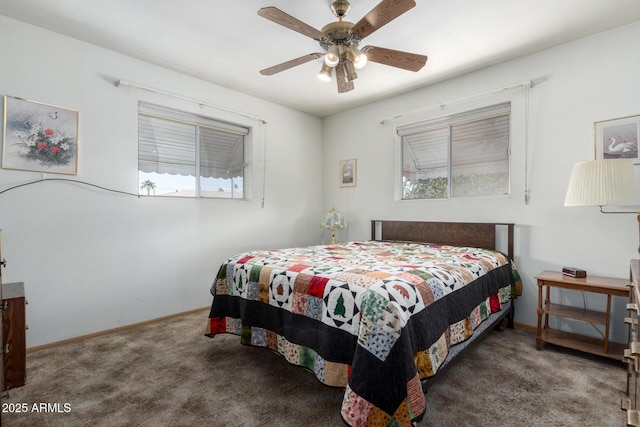 bedroom featuring ceiling fan and dark carpet