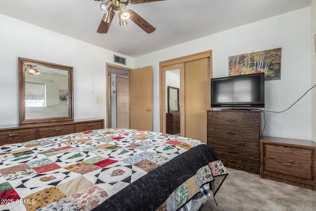 bedroom featuring ceiling fan and light carpet