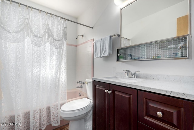 full bathroom featuring toilet, vanity, and shower / bath combo with shower curtain