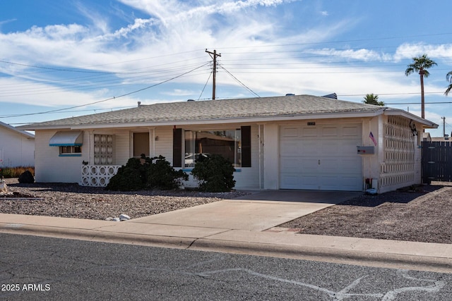 ranch-style house featuring a garage