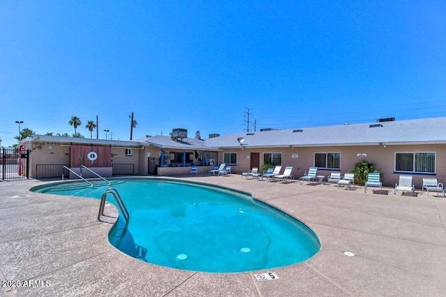 view of swimming pool featuring a patio area