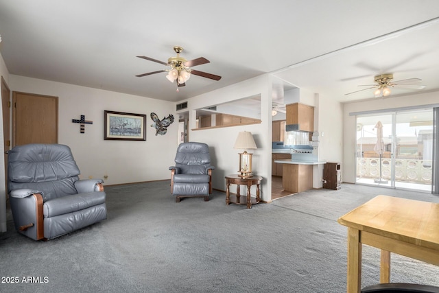 carpeted living room with ceiling fan