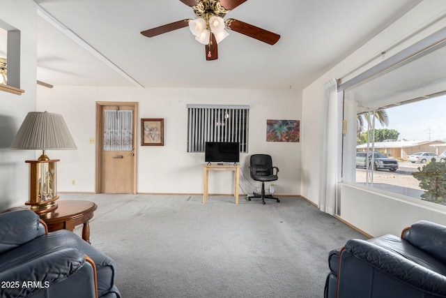 living room with carpet flooring and ceiling fan