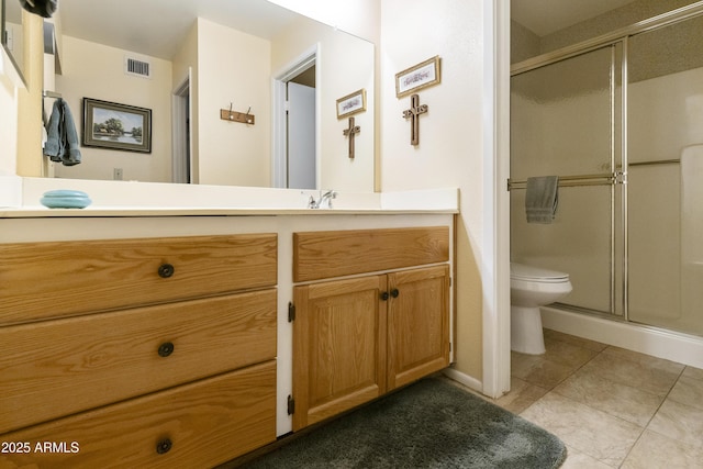 bathroom with vanity, an enclosed shower, tile patterned floors, and toilet