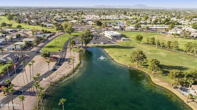 drone / aerial view featuring a water and mountain view